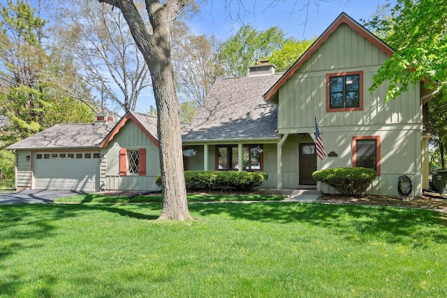 530 W Acacia Rd, Glendale, WI 53217 - rustic home with a garage, a chimney, a front lawn, roof with shingles, and board and batten siding
