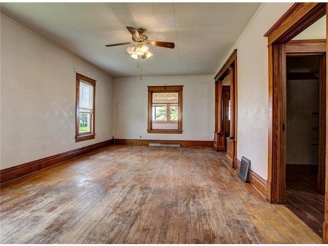N4190 S County Road P, Spring Valley, WI 54767 - empty room featuring hardwood / wood-style floors, a ceiling fan, baseboards, and baseboard heating