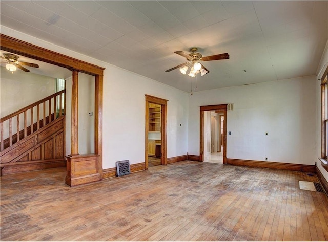 N4190 S County Road P, Spring Valley, WI 54767 - unfurnished room featuring ceiling fan, wood-type flooring, stairway, and baseboards