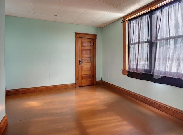 N4190 S County Road P, Spring Valley, WI 54767 - spare room with wood finished floors, baseboards, and a drop ceiling