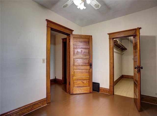 N4190 S County Road P, Spring Valley, WI 54767 - unfurnished bedroom with wood finished floors, ceiling fan, and baseboards