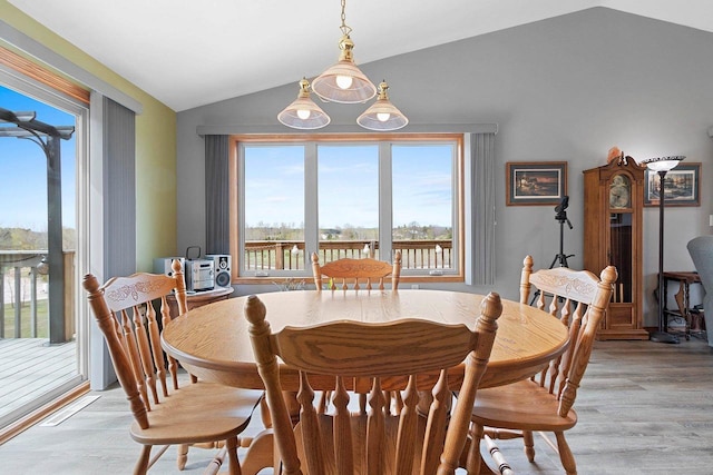 N3351 County Road B, Kewaunee, WI 54216 - dining area with lofted ceiling, healthy amount of natural light, and light wood finished floors