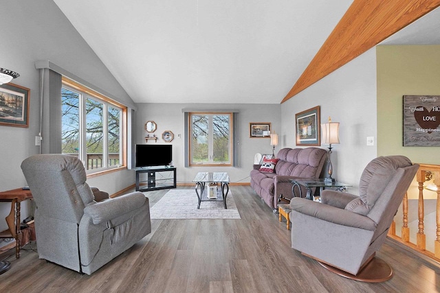 N3351 County Road B, Kewaunee, WI 54216 - living area with lofted ceiling, wood finished floors, and baseboards