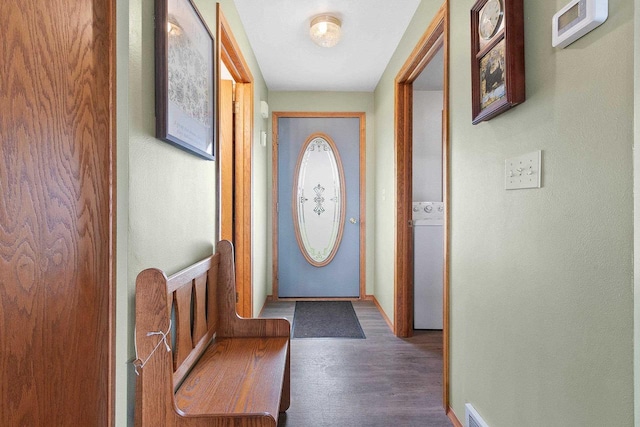 N3351 County Road B, Kewaunee, WI 54216 - doorway with washer / dryer, wood finished floors, and baseboards