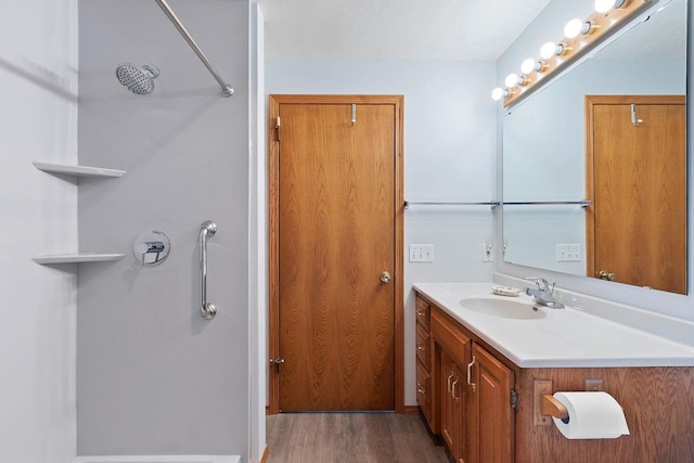 N3351 County Road B, Kewaunee, WI 54216 - bathroom with wood finished floors, a shower, and vanity