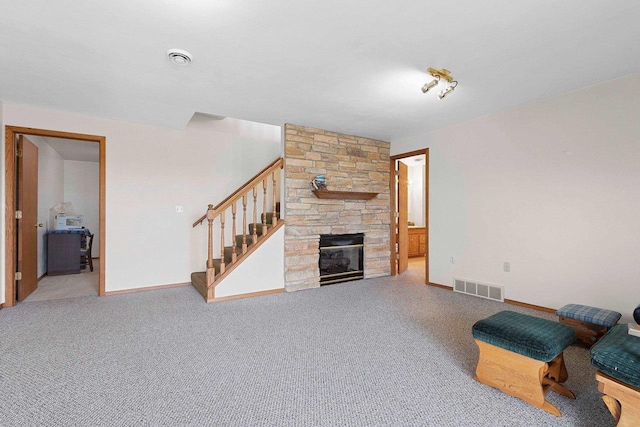 N3351 County Road B, Kewaunee, WI 54216 - unfurnished living room featuring stairway, a fireplace, baseboards, and carpet flooring