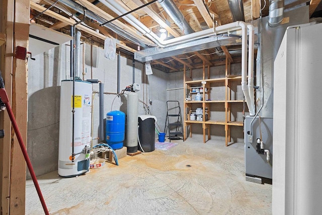 N3351 County Road B, Kewaunee, WI 54216 - unfinished below grade area with water heater, a water pressure tank, and a water softener system