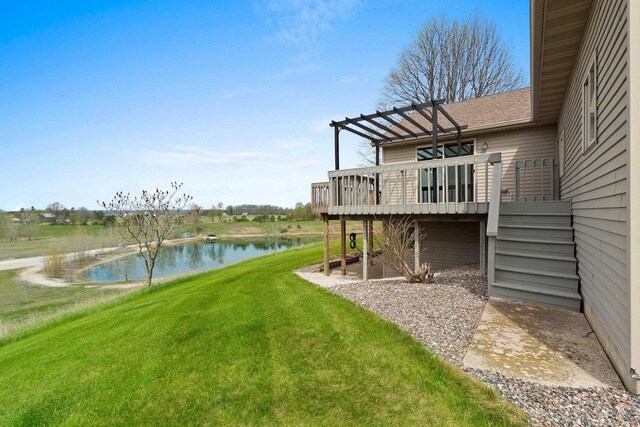 N3351 County Road B, Kewaunee, WI 54216 - view of green lawn featuring a deck with water view, a pergola, and stairs