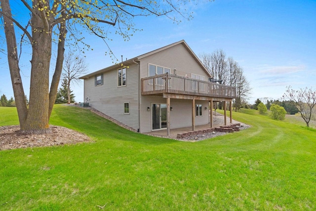 N3351 County Road B, Kewaunee, WI 54216 - back of house with a wooden deck, a lawn, and a patio area