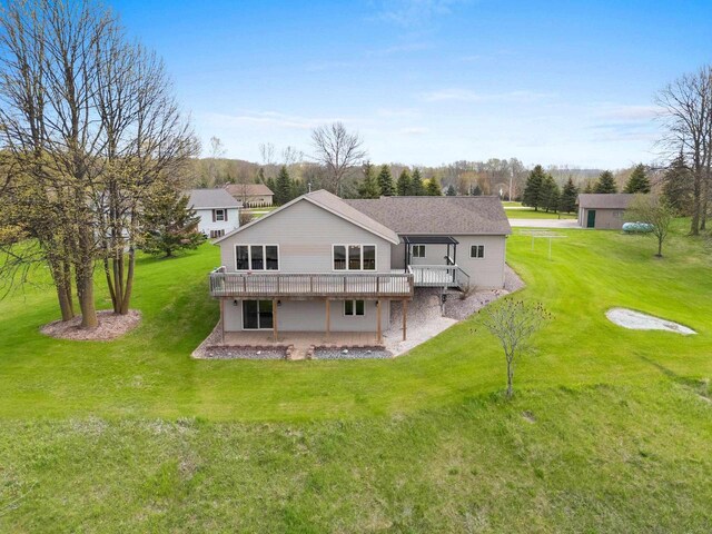 N3351 County Road B, Kewaunee, WI 54216 - back of property featuring a wooden deck, a lawn, and a patio