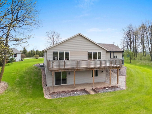 N3351 County Road B, Kewaunee, WI 54216 - rear view of house featuring a wooden deck, a yard, and a patio