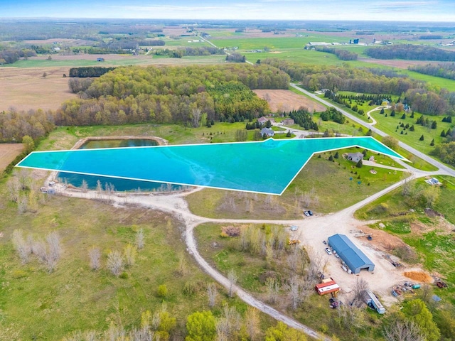 N3351 County Road B, Kewaunee, WI 54216 - aerial overview of property's location featuring a pool area, rural landscape, and property parcel outlined
