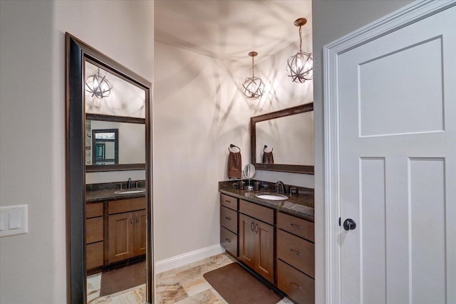 1002 Millies Way, Waunakee, WI 53597 - bathroom featuring two vanities and baseboards