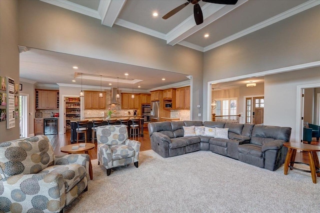 1002 Millies Way, Waunakee, WI 53597 - living area with wine cooler, recessed lighting, ornamental molding, ceiling fan, and light wood finished floors