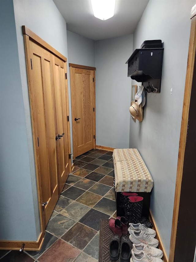W7429 Akron Dr, Wild Rose, WI 54984 - mudroom with dark stone finish floors and baseboards