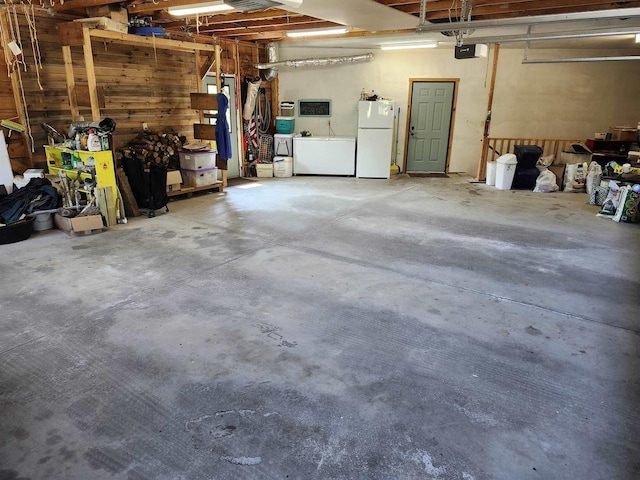 W7429 Akron Dr, Wild Rose, WI 54984 - garage with freestanding refrigerator and washer and clothes dryer