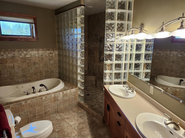 W7429 Akron Dr, Wild Rose, WI 54984 - full bathroom featuring tile walls, walk in shower, a garden tub, tile patterned floors, and toilet