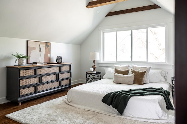 bedroom with wood finished floors and baseboards