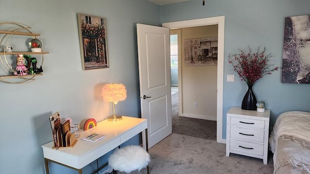 bedroom featuring light carpet
