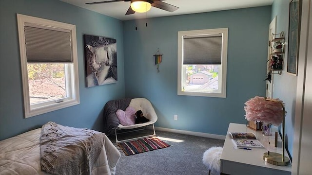 carpeted bedroom featuring a ceiling fan and baseboards