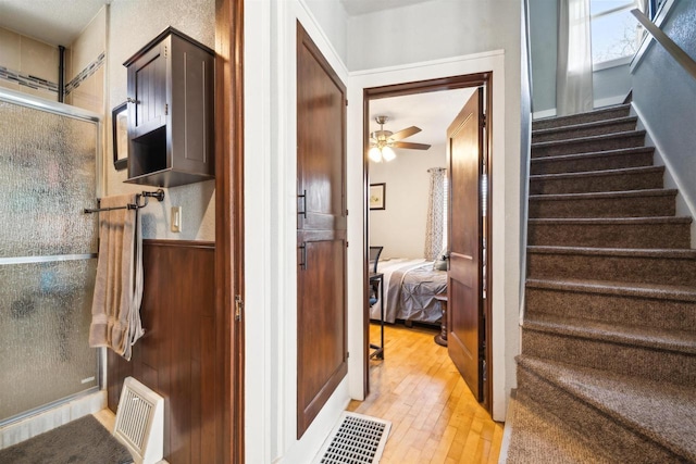 129 W 19th Ave, Oshkosh, WI 54902 - stairway featuring wood-type flooring and ceiling fan