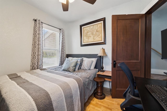 129 W 19th Ave, Oshkosh, WI 54902 - bedroom with light wood-style floors, an office area, and ceiling fan