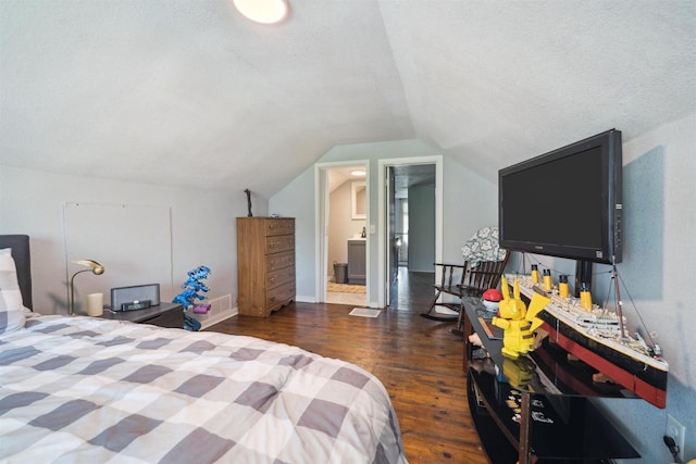 129 W 19th Ave, Oshkosh, WI 54902 - bedroom with wood finished floors, vaulted ceiling, a textured ceiling, and baseboards