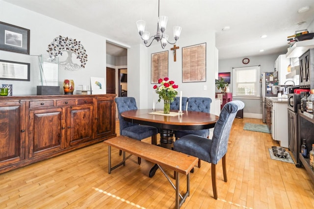 129 W 19th Ave, Oshkosh, WI 54902 - dining space featuring light wood-type flooring, a chandelier, and recessed lighting