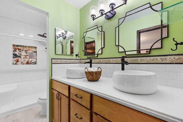 2734 Old Mill Dr Unit A-2, Racine, WI 53405 - full bathroom with toilet, double vanity, a wainscoted wall, and tile walls