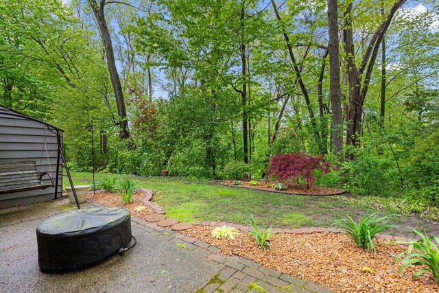 2734 Old Mill Dr Unit A-2, Racine, WI 53405 - view of yard featuring a fire pit and a patio area