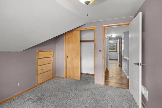 409 S Matthew St, Kimberly, WI 54136 - bonus room with lofted ceiling, carpet flooring, and baseboards