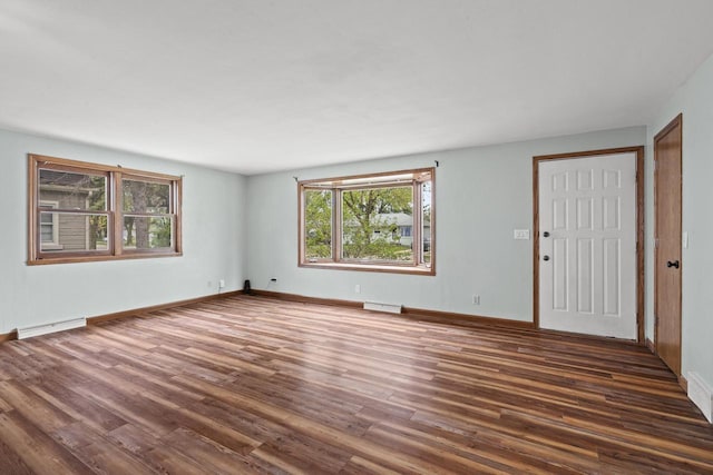 409 S Matthew St, Kimberly, WI 54136 - spare room featuring dark wood finished floors and baseboards