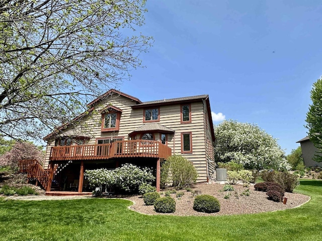 86 Ledgebrook Dr, Fond Du Lac, WI 54935 - back of house featuring a deck, a lawn, and central air condition unit