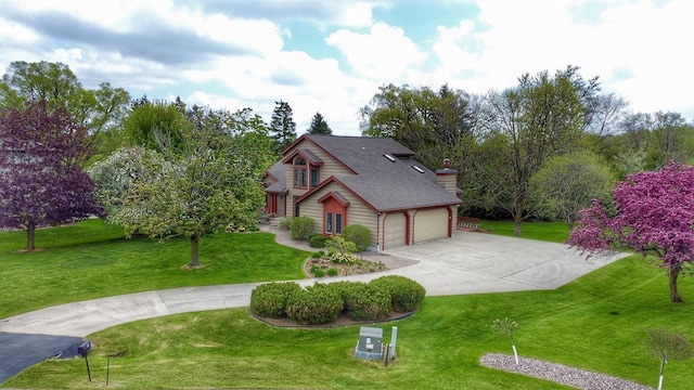 86 Ledgebrook Dr, Fond Du Lac, WI 54935 - view of front of property with driveway, a front lawn, a chimney, and a shingled roof