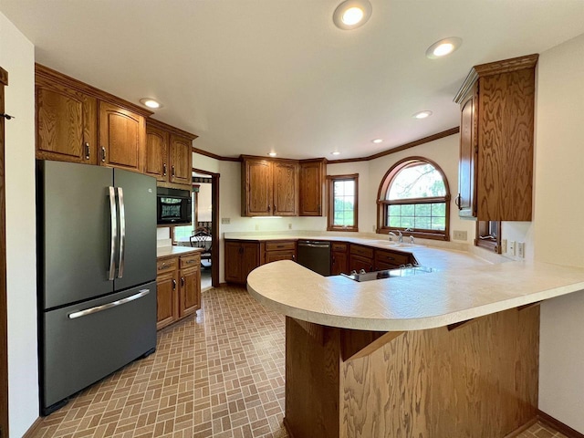 86 Ledgebrook Dr, Fond Du Lac, WI 54935 - kitchen featuring freestanding refrigerator, dishwasher, black microwave, a sink, and light countertops