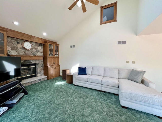 86 Ledgebrook Dr, Fond Du Lac, WI 54935 - carpeted living room featuring vaulted ceiling, ceiling fan, a stone fireplace, and recessed lighting