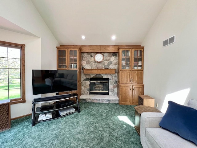 86 Ledgebrook Dr, Fond Du Lac, WI 54935 - carpeted living room featuring vaulted ceiling, a fireplace, baseboards, and recessed lighting