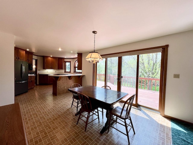 86 Ledgebrook Dr, Fond Du Lac, WI 54935 - dining room with recessed lighting, baseboards, brick patterned floors, and french doors