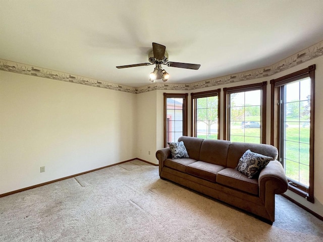 86 Ledgebrook Dr, Fond Du Lac, WI 54935 - living room with light carpet, healthy amount of natural light, baseboards, and a ceiling fan