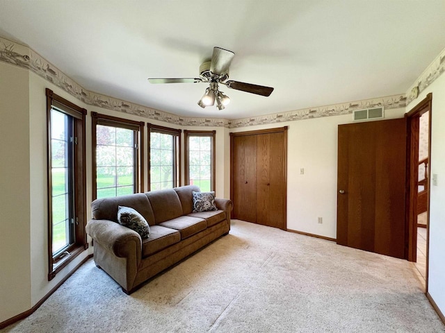 86 Ledgebrook Dr, Fond Du Lac, WI 54935 - carpeted living room featuring healthy amount of natural light, a ceiling fan, and baseboards