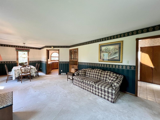86 Ledgebrook Dr, Fond Du Lac, WI 54935 - living area with wainscoting and light carpet