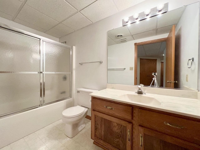86 Ledgebrook Dr, Fond Du Lac, WI 54935 - full bath with a paneled ceiling, toilet, vanity, shower / bath combination with glass door, and tile patterned floors