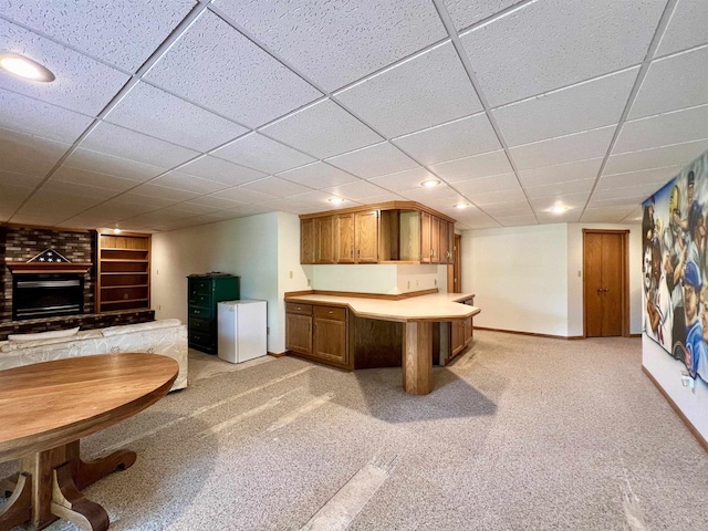 86 Ledgebrook Dr, Fond Du Lac, WI 54935 - bar with baseboards, built in shelves, freestanding refrigerator, a drop ceiling, and light colored carpet