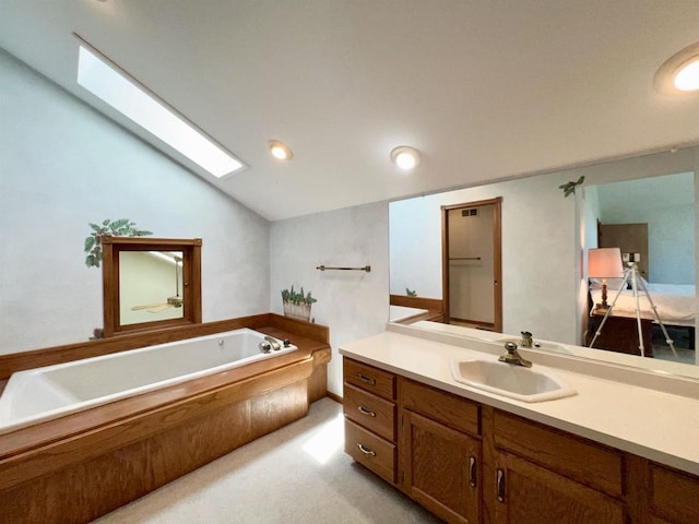 86 Ledgebrook Dr, Fond Du Lac, WI 54935 - full bathroom with a garden tub, vaulted ceiling, vanity, a skylight, and recessed lighting