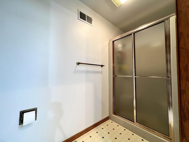 86 Ledgebrook Dr, Fond Du Lac, WI 54935 - bathroom featuring baseboards, tile patterned floors, and a shower with shower door
