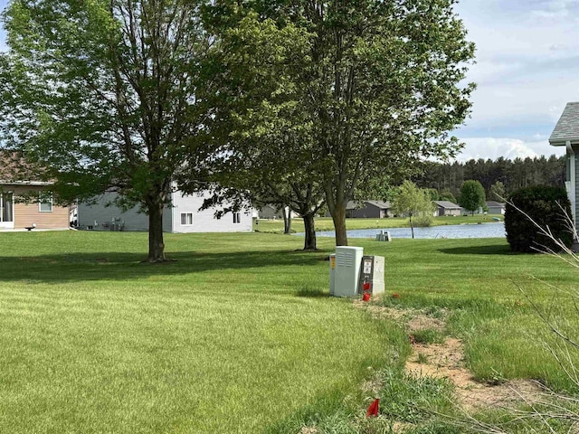 804 NW Cumberland St, Berlin, WI 54923 - view of grassy yard featuring a water view