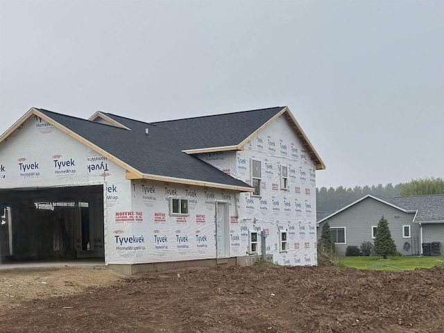 804 NW Cumberland St, Berlin, WI 54923 - view of front of house featuring central AC and a shingled roof
