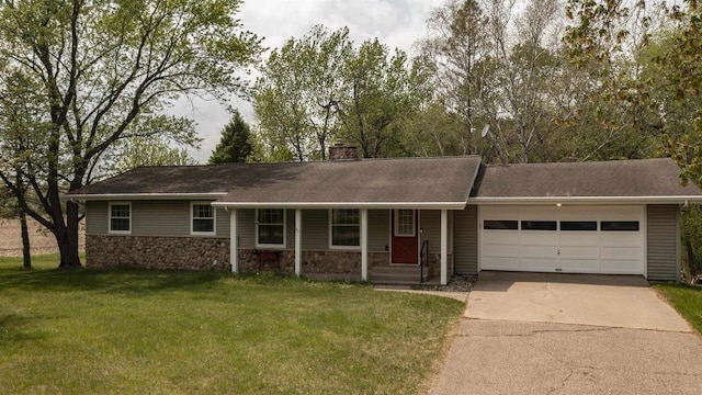 N2757 Shadow Rd, Waupaca, WI 54981 - ranch-style home with driveway, an attached garage, a front lawn, a chimney, and a porch