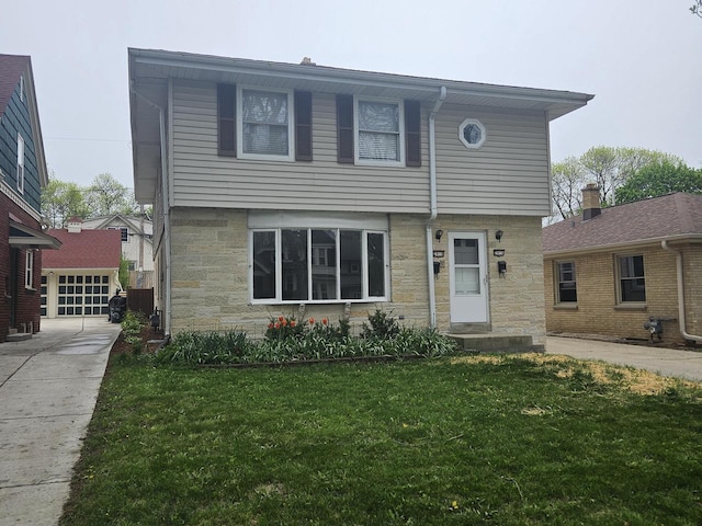 2416 N 69th St Unit 2418, Wauwatosa, WI 53213 - view of front of house featuring a front yard, stone siding, driveway, and a garage