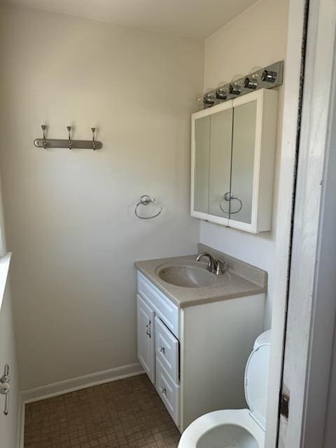 2416 N 69th St Unit 2418, Wauwatosa, WI 53213 - bathroom with vanity, toilet, and baseboards